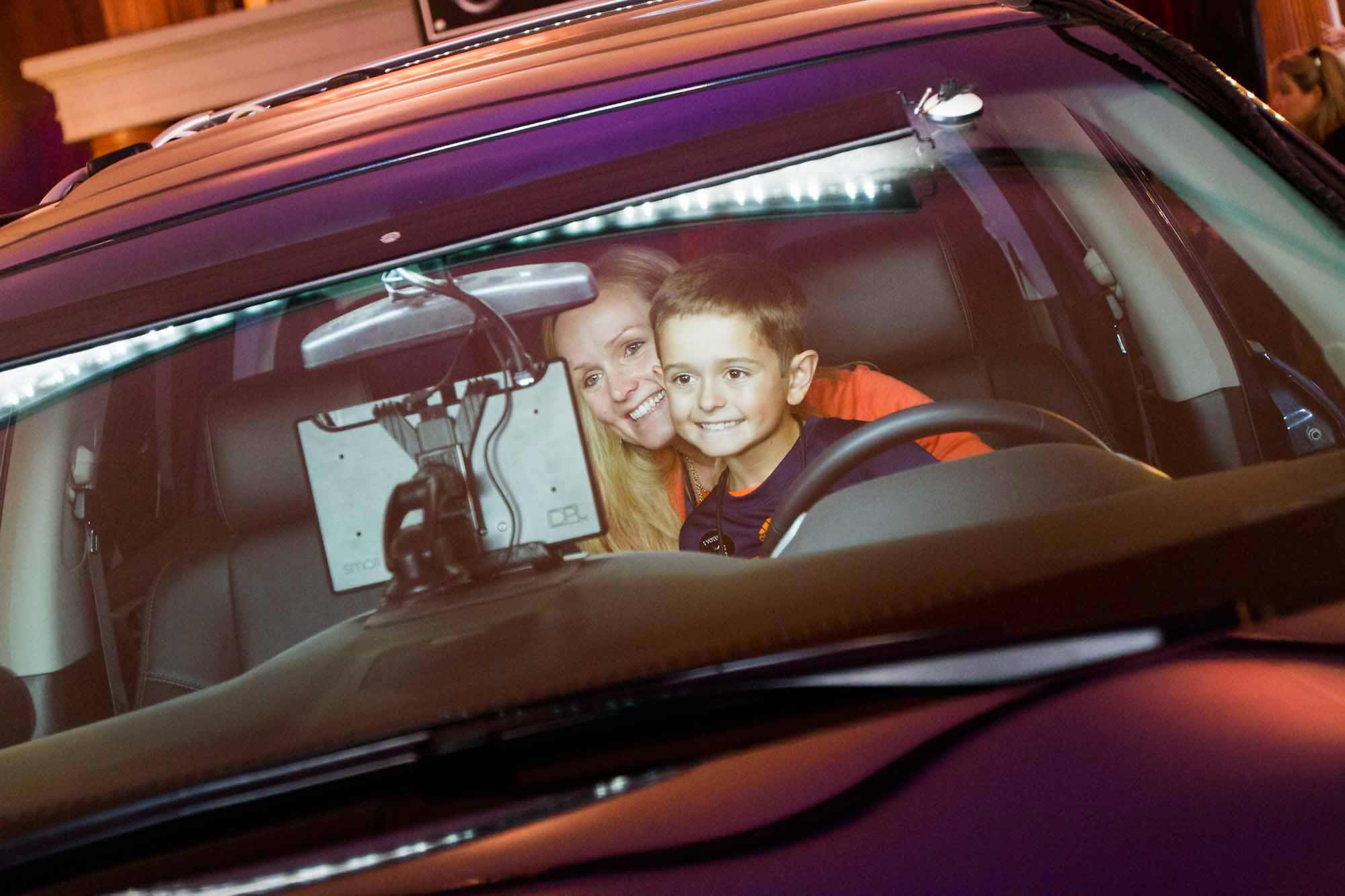 Mother and son in the Nissan vehicle photo booth