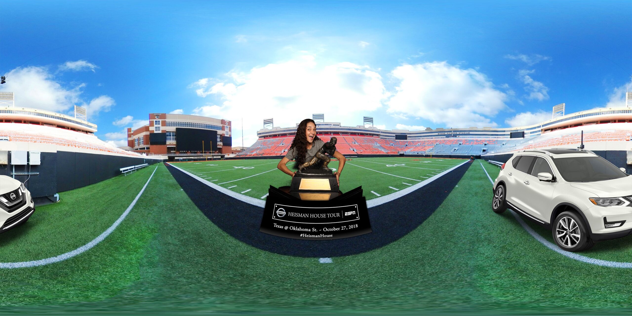 360-degree stadium photo with the Heisman Trophy and Nissan vehicles